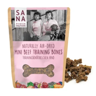 Pink pouch labeled Sana Premium Dog Foods: Naturally Air-Dried Mini Beef Training Bones, featuring a vintage photo of two girls with a dog on the label.