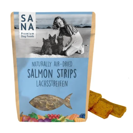 Dog treat package for salmon strips (SANA Premium Dog Foods) with a vintage photo of a woman and two dogs on a beach.